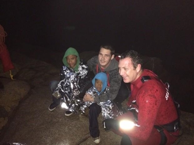 High tide traps man, two boys